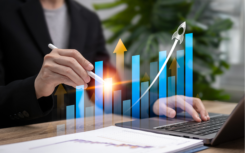 Hand pointing at increasing financial graph