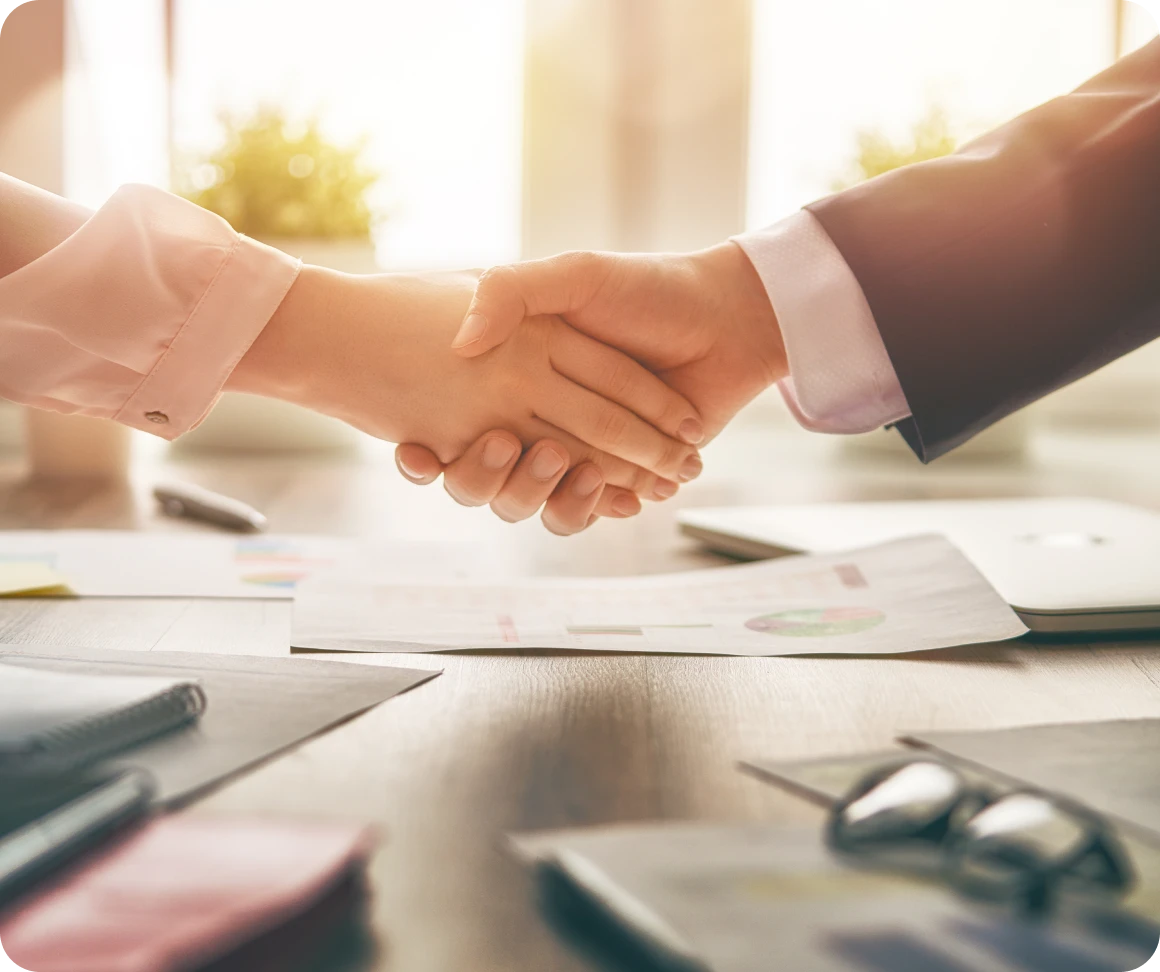Two people shaking hands in agreement